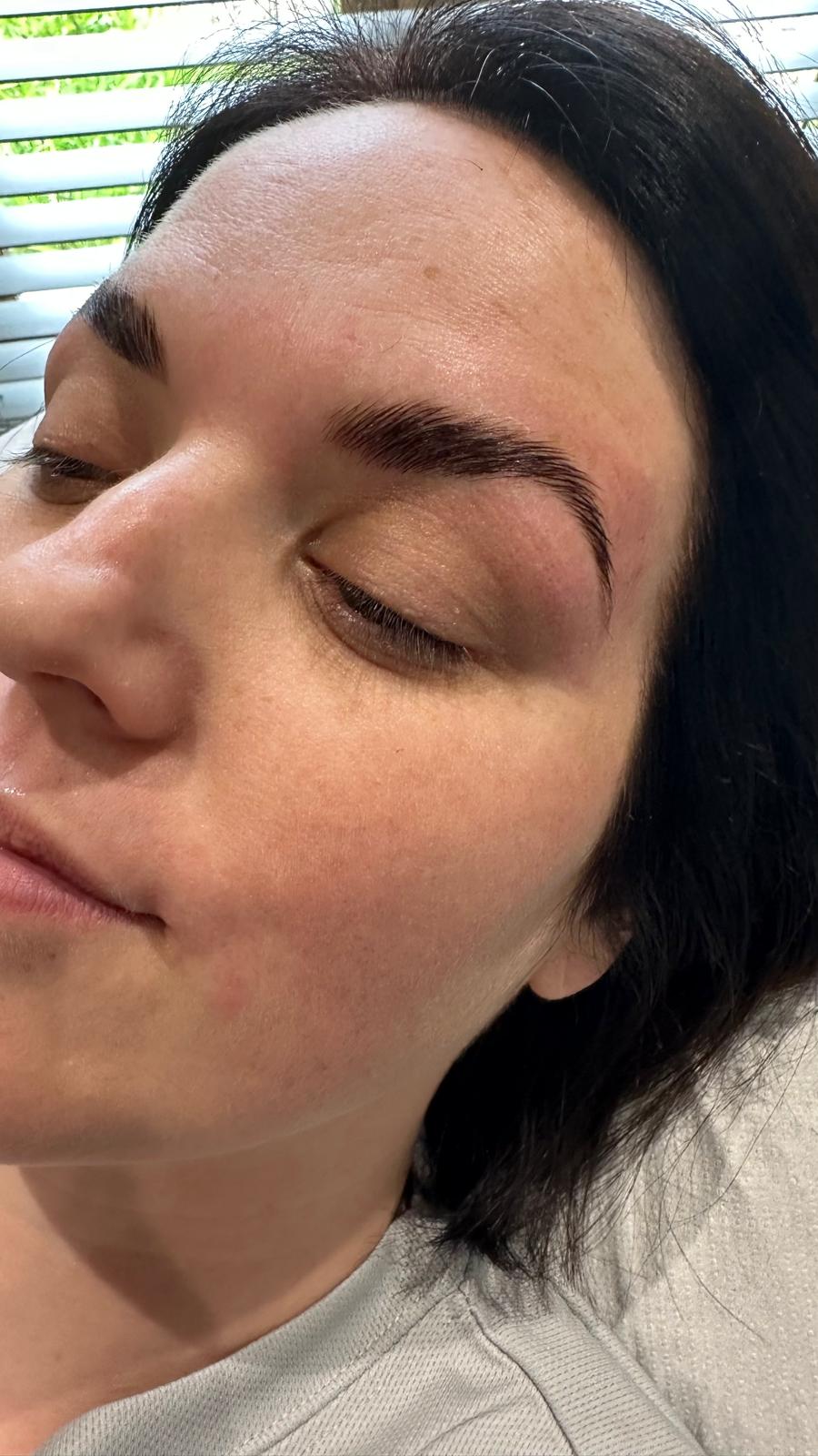 A laminated and tinted brow, brushed up and shaped