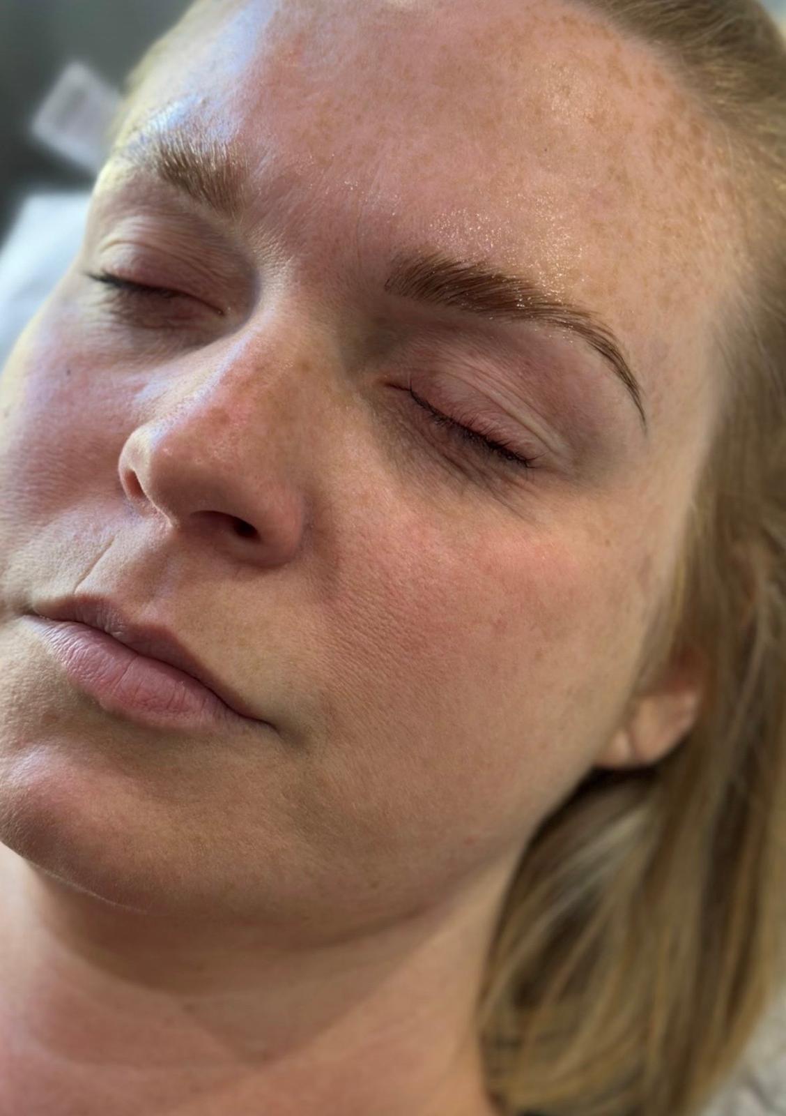 A laminated brow in a soft light brown, brushed up and shaped